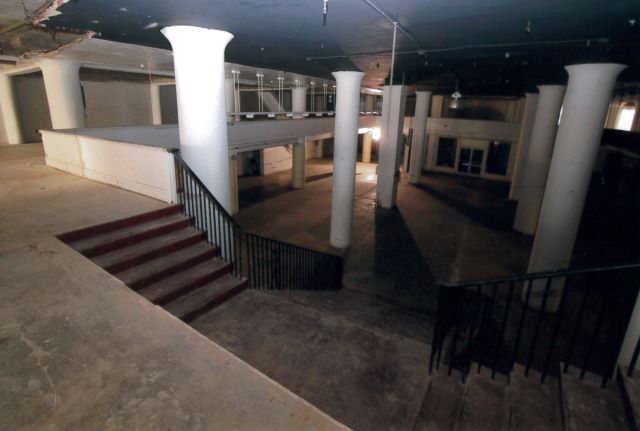 Before: Overall view of unrestored store main floor from mezzanine